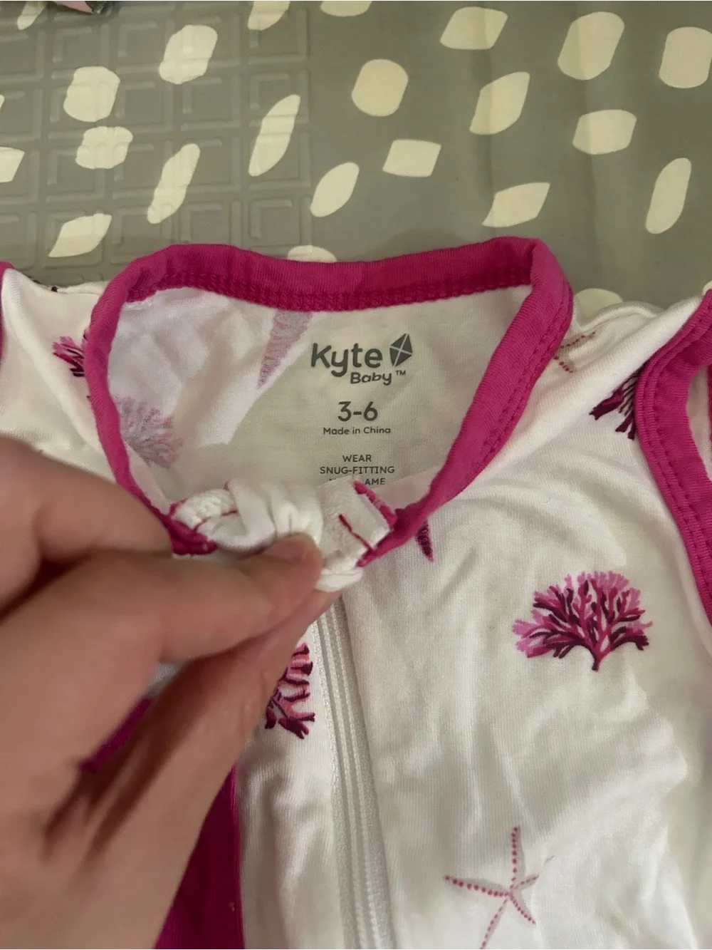 Kyte Baby Sleeveless White Baby Romper with Raspberry Shell Print